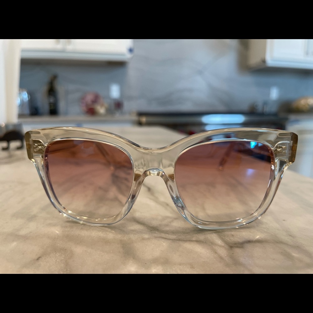 Oliver People’s sunglasses. Clear frames, tinted lenses. Brand new w/hard case